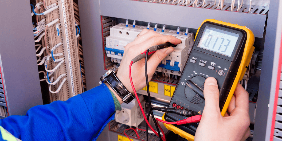 electrician inspecting power levels